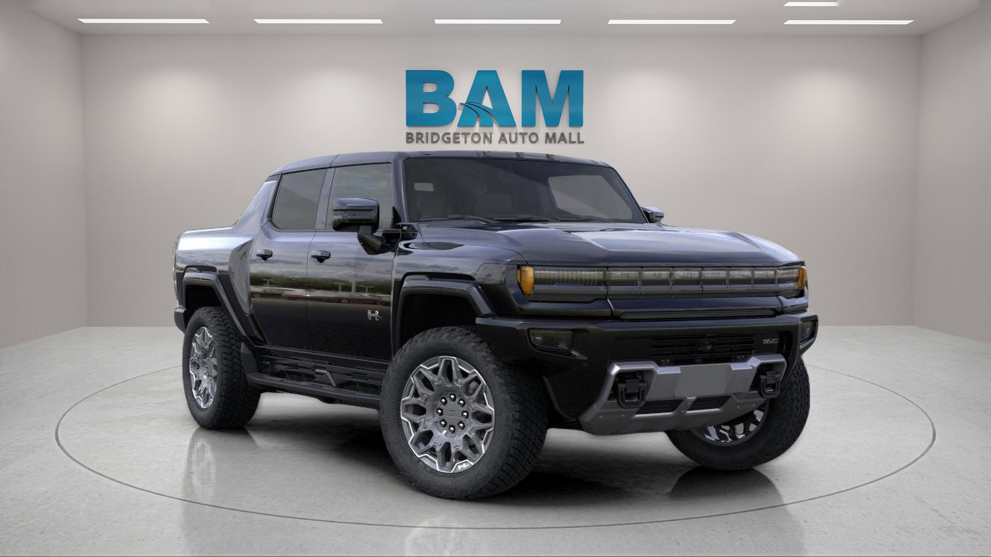 2025 GMC HUMMER EV Pickup 3X in Void Black — front three-quarter view