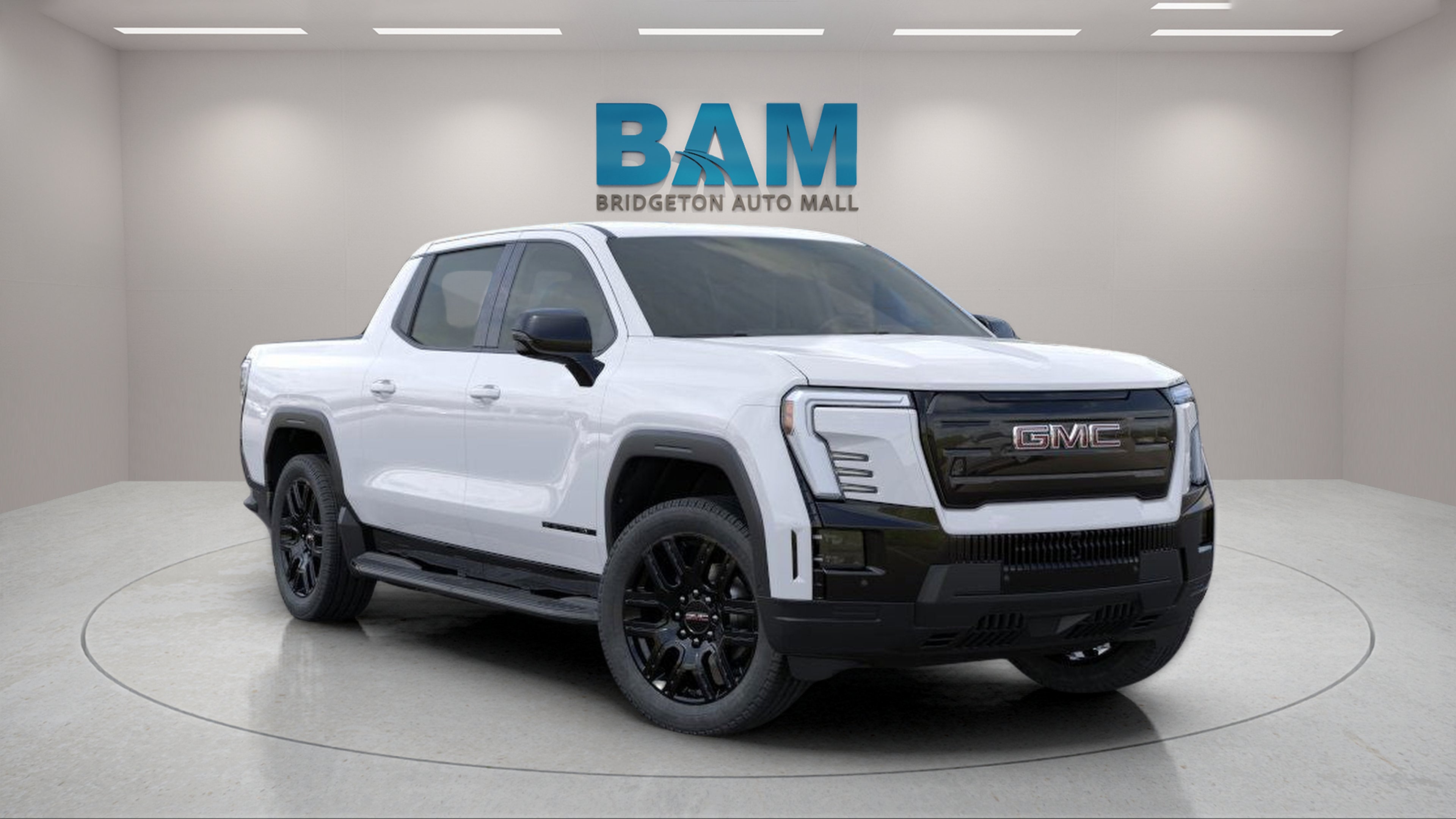 2026 GMC Sierra EV Elevation Standard Range in Summit White — front three-quarter view