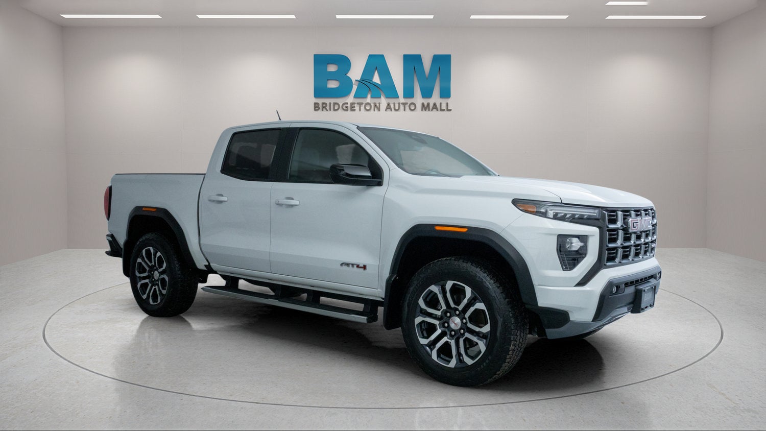 2023 GMC Canyon AT4 in Summit White — front three-quarter view