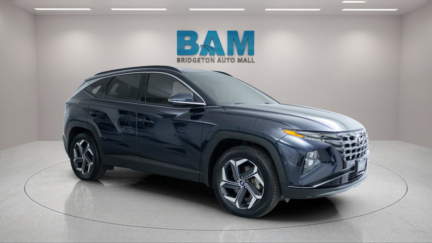 2024 Hyundai Tucson Plug-In Hybrid Limited in Blue — front three-quarter view